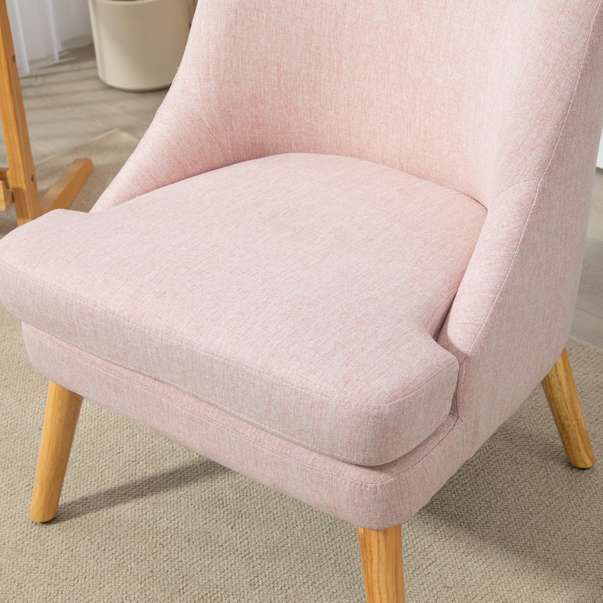 Logidon lounge chair pink linen look upholstered with wooden legs