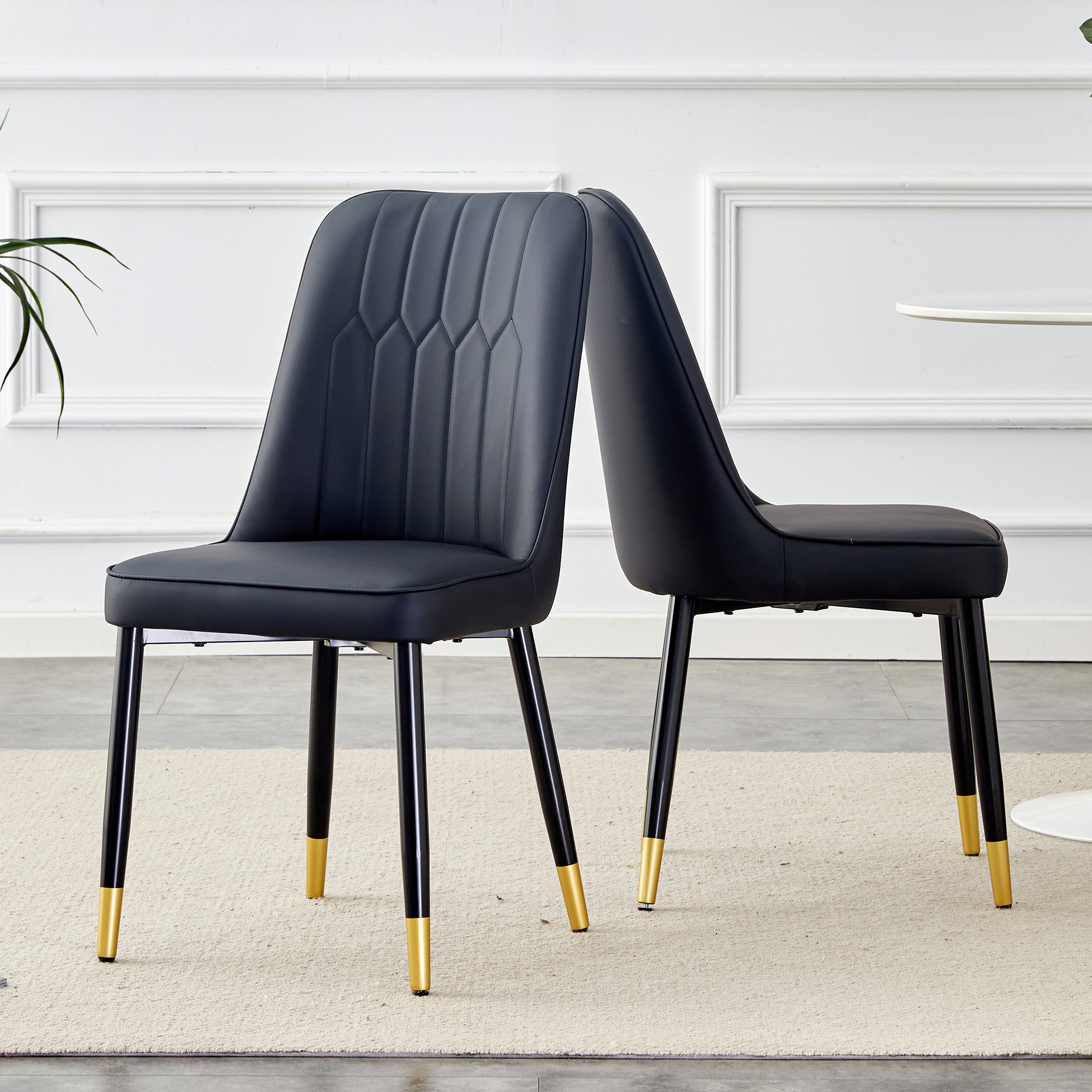 Logidon set van twee zwarte eetkamerstoelen met PU lederen rugkussens