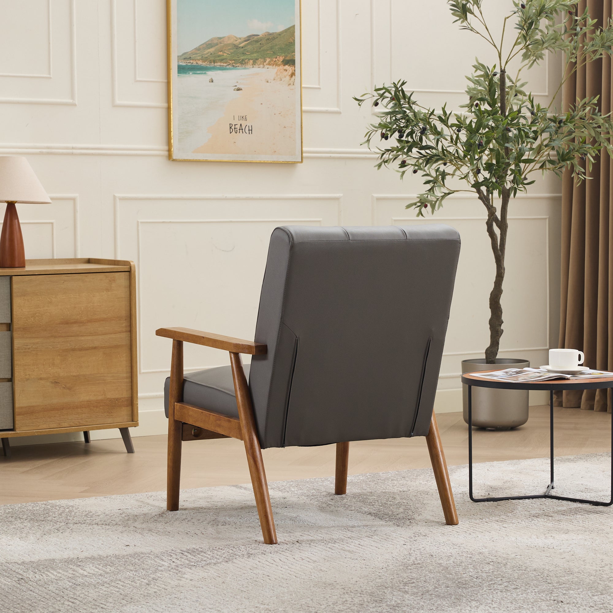 Logidon grijze fauteuil van echt leer met armleuningen van notenhout