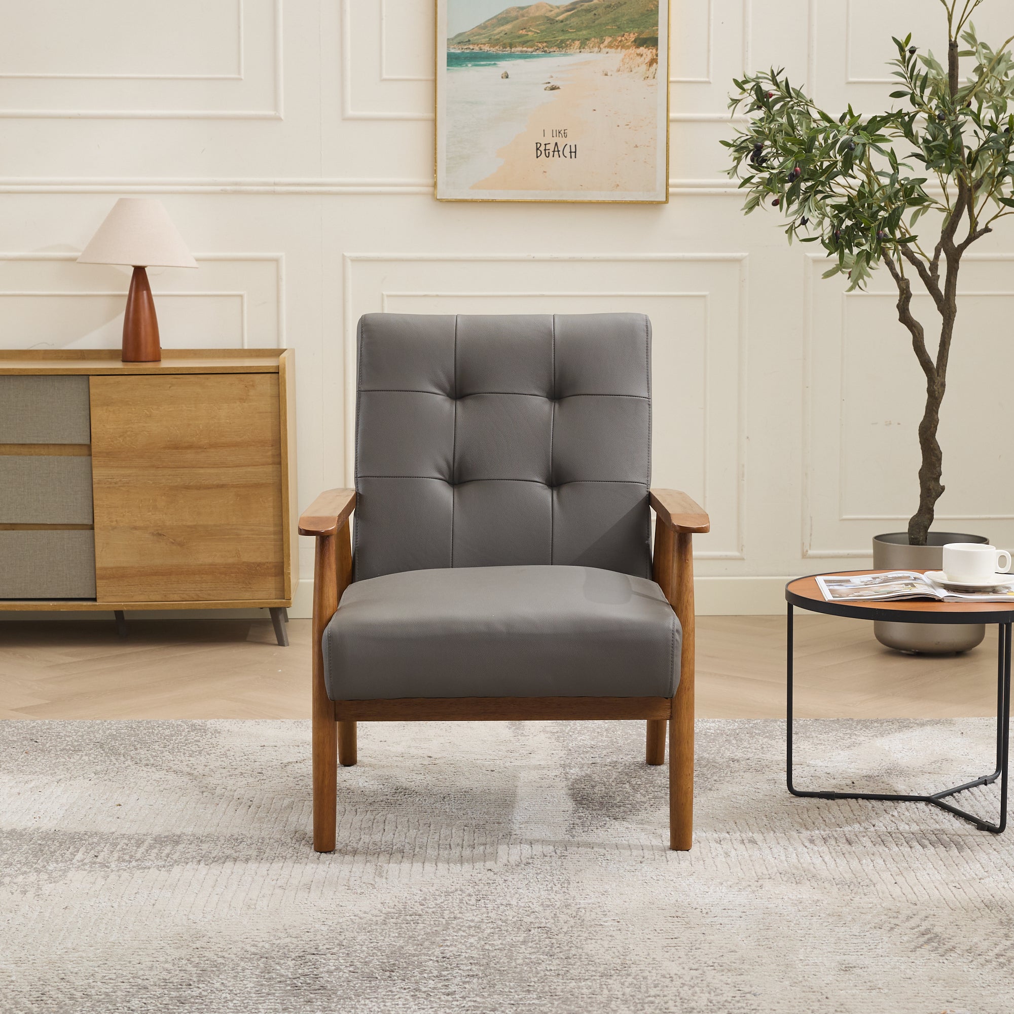 Logidon grijze fauteuil van echt leer met armleuningen van notenhout